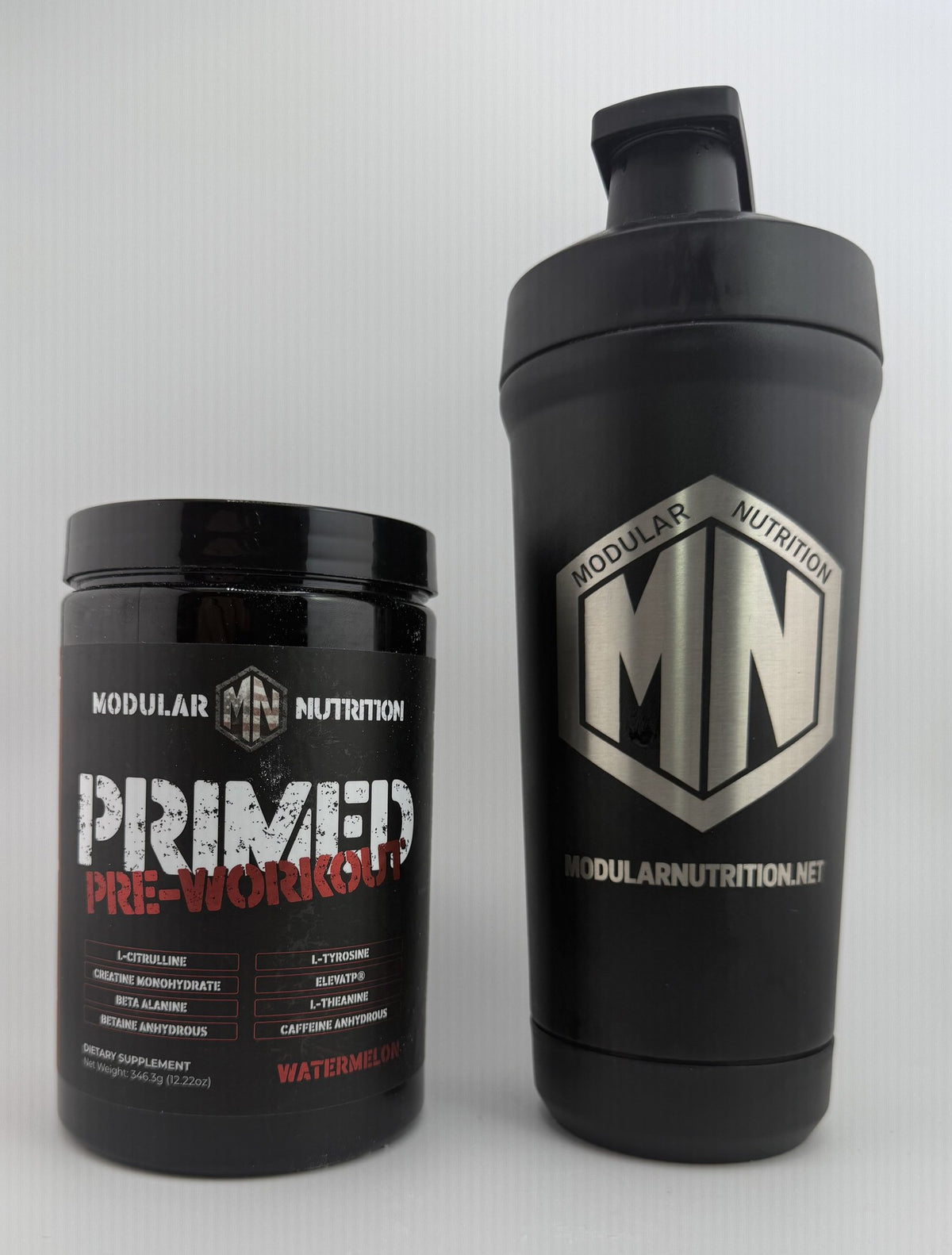 Primed Pre-Workout Watermelon jar next to the Modular Nutrition logo shaker bottle